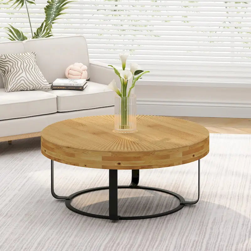 Table basse ronde moderne en bois sculpté avec pieds en métal